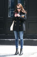 EMMA ROBERTS Smokes a Cigarette Out in New York 03/30/2017