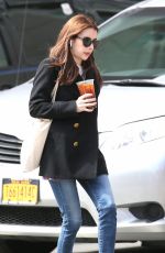 EMMA ROBERTS Smokes a Cigarette Out in New York 03/30/2017