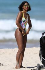 KELLY ROWLAND in Swimsuit on the Beach in Sydney 03/27/2017