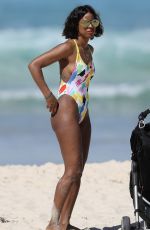 KELLY ROWLAND in Swimsuit on the Beach in Sydney 03/27/2017