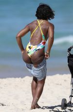 KELLY ROWLAND in Swimsuit on the Beach in Sydney 03/27/2017