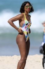 KELLY ROWLAND in Swimsuit on the Beach in Sydney 03/27/2017