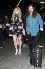 KESHA SEBERT with Her Boyfriend Brad Ashenfelter at LAX in Los Angeles 03/22/2017