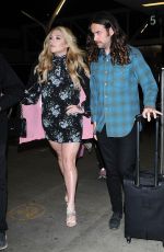 KESHA SEBERT with Her Boyfriend Brad Ashenfelter at LAX in Los Angeles 03/22/2017