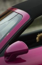 MICHELLE HUNZIKER Driving Her New Porsche Out in Milan 03/24/2017