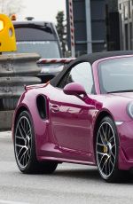 MICHELLE HUNZIKER Driving Her New Porsche Out in Milan 03/24/2017