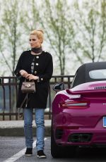 MICHELLE HUNZIKER Driving Her New Porsche Out in Milan 03/24/2017