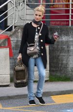 MICHELLE HUNZIKER Driving Her New Porsche Out in Milan 03/24/2017