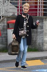 MICHELLE HUNZIKER Driving Her New Porsche Out in Milan 03/24/2017
