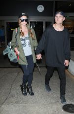 PARIS HILTON and Chris Zylka at LAX Airport in Los Angeles 03/15/2017