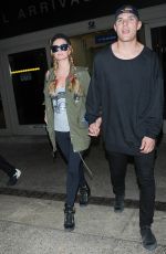 PARIS HILTON and Chris Zylka at LAX Airport in Los Angeles 03/15/2017