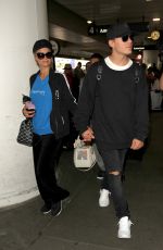 PARIS HILTON and Chris Zylka at LAX Airport in Los Angeles 03/28/2017