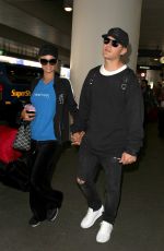 PARIS HILTON and Chris Zylka at LAX Airport in Los Angeles 03/28/2017