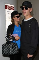 PARIS HILTON and Chris Zylka at LAX Airport in Los Angeles 03/28/2017