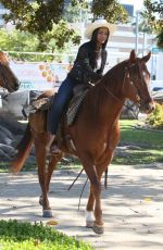 RACHEL LINDSAY Rides a Horse in Beverly Hills - march 23, 2017