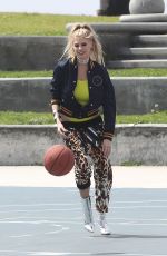 CHARLOTTE MCKINNEY on the Set of a Photoshoot in Venice Beach 04/04/2017