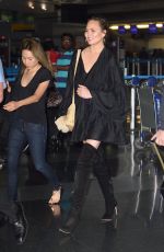 CHRISSY TEIGEN at JFK Airport in Los Angeles 04/12/2017