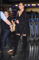 CHRISSY TEIGEN at JFK Airport in Los Angeles 04/12/2017