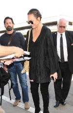 CHRISSY TEIGEN at LAX Airport in Los Angeles 04/12/2017