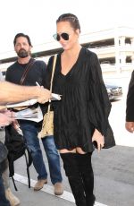 CHRISSY TEIGEN at LAX Airport in Los Angeles 04/12/2017
