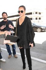 CHRISSY TEIGEN at LAX Airport in Los Angeles 04/12/2017