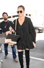 CHRISSY TEIGEN at LAX Airport in Los Angeles 04/12/2017