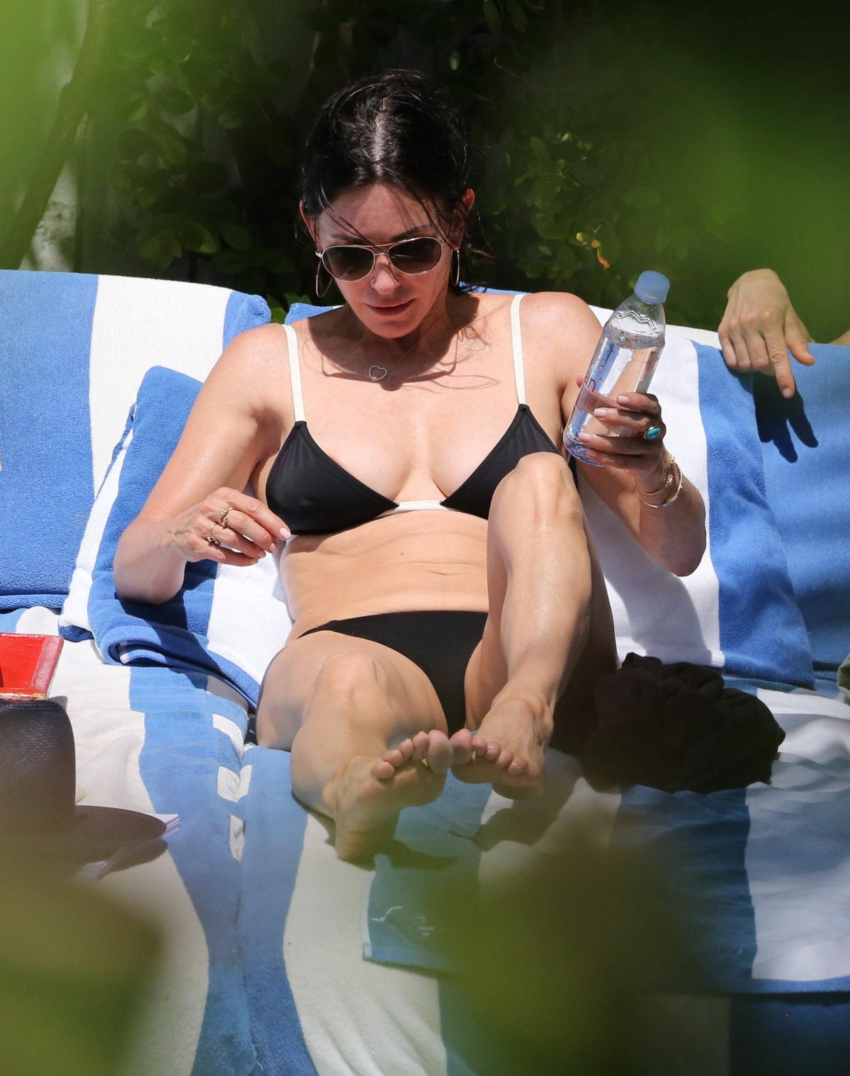 COURTENEY COX in Bikini at a Pool in Miami 03/31/2017.