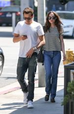 DAKOTA JOHNSON Leaves Hugo