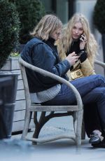 ELSA HOSK and Tom Daly on a bench in New York 04/09/2017