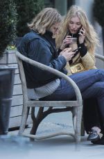 ELSA HOSK and Tom Daly on a bench in New York 04/09/2017