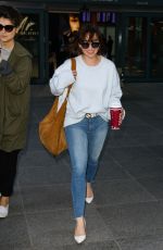 EMILIA CLARKE in Jeans at Heathrow Airport in London 04/20/2017
