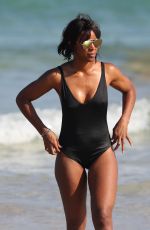 KELLY ROWLAND in Swimsuit at a Beach in Sydney 03/29/2017