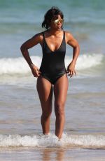 KELLY ROWLAND in Swimsuit at a Beach in Sydney 03/29/2017