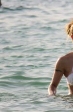 MICHELLE HUNZIKER in Bikini at a Beach in Dubai 04/12/2017