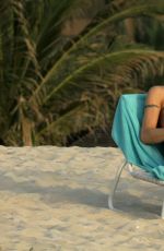 MICHELLE HUNZIKER in Bikini on the Beach in Dubai 04/11/2017