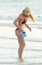 MICHELLE HUNZIKER in Bikini on the Beach in Dubai 04/11/2017