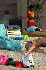 MICHELLE HUNZIKER in Bikini on the Beach in Dubai 04/11/2017