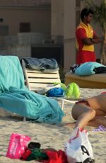 MICHELLE HUNZIKER in Bikini on the Beach in Dubai 04/11/2017