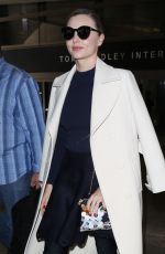 MIRANDA KERR at LAX Airport in Los Angeles 04/04/2017