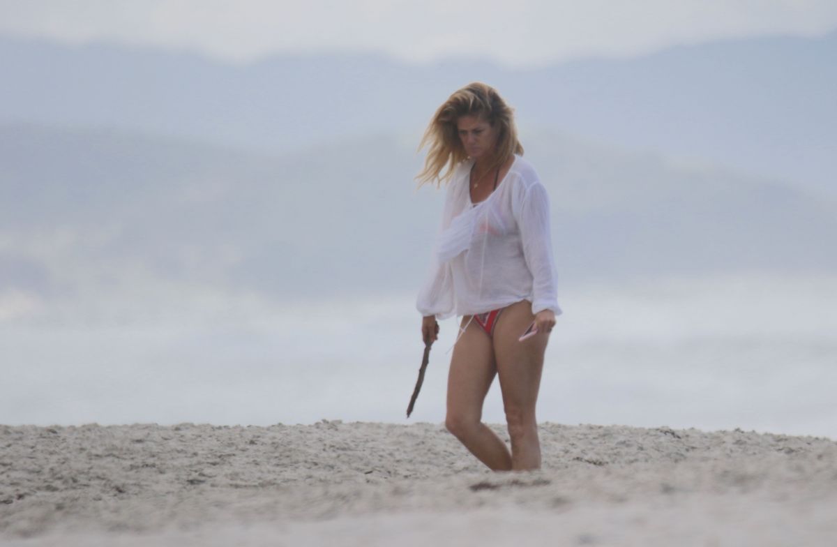 RACHEL HUNTER in Bikini on the Beach in New Zealand 03/19 