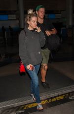 RILEY KEOUGH and Ben Smith-Petersen at LAX Airport in Los Angeles 04/10/2017