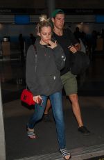 RILEY KEOUGH and Ben Smith-Petersen at LAX Airport in Los Angeles 04/10/2017