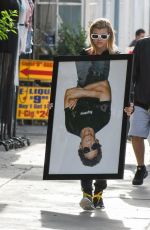 SOFIA RICHIE Holds Framed Photograph of Lou Reed Out in Los Angeles 04/24/2017
