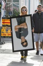 SOFIA RICHIE Holds Framed Photograph of Lou Reed Out in Los Angeles 04/24/2017