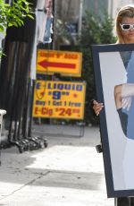 SOFIA RICHIE Holds Framed Photograph of Lou Reed Out in Los Angeles 04/24/2017
