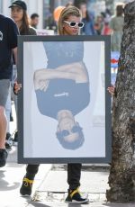 SOFIA RICHIE Holds Framed Photograph of Lou Reed Out in Los Angeles 04/24/2017