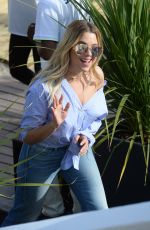 ASHLEY BENSON in Jeans Leaves Martinez Beach in Cannes 05/21/2017