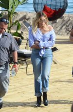 ASHLEY BENSON in Jeans Leaves Martinez Beach in Cannes 05/21/2017
