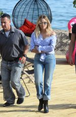 ASHLEY BENSON in Jeans Leaves Martinez Beach in Cannes 05/21/2017
