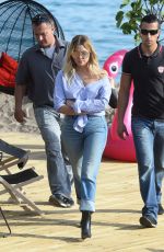 ASHLEY BENSON in Jeans Leaves Martinez Beach in Cannes 05/21/2017